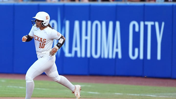 Texas's Mia Scott (10) runs the basses after hitting a grand slam in the fourth inning during the Women's College World Series championship game between Texas Tech and Texas at Devon Park, Friday, June, 6, 2025, in Oklahoma City.