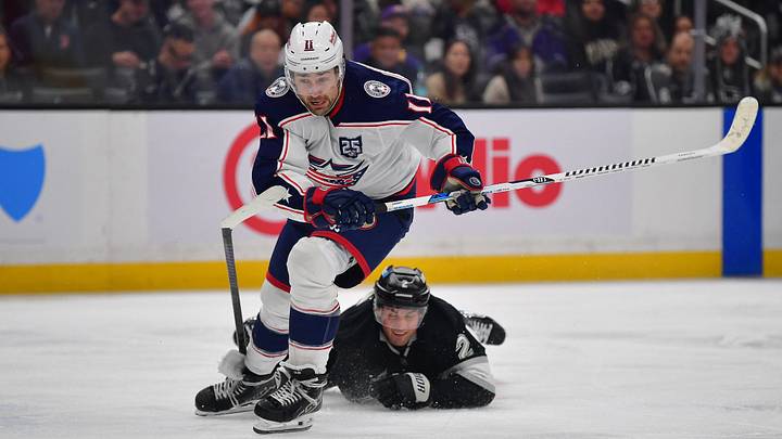 Dec 22, 2025; Los Angeles, California, USA; Columbus Blue Jackets left wing Miles Wood (11) moves the puck ahead of Los Angeles Kings defenseman Brian Dumoulin (2) during the third period at Crypto.com Arena. Mandatory Credit: Gary A. Vasquez-Imagn Images Dec 22, 2025; Los Angeles, California, USA; Columbus Blue Jackets left wing Miles Wood (11) moves the puck ahead of Los Angeles Kings defenseman Brian Dumoulin (2) during the third period at Crypto.com Arena. Mandatory Credit: Gary A. Vasquez-Imagn Images