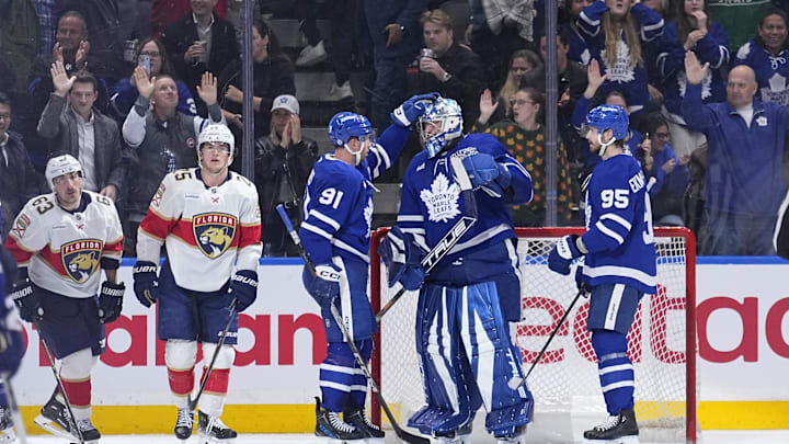 Apr 2, 2025; Toronto, Ontario, CAN; Toronto Maple Leafs forward John Tavares (91) and defenseman Oliver Ekman-Larsson (95) congratulate goaltender Anthony Stolarz (41) after a win against the Florida Panthers at Scotiabank Arena. Mandatory Credit: John E. Sokolowski-Imagn Images