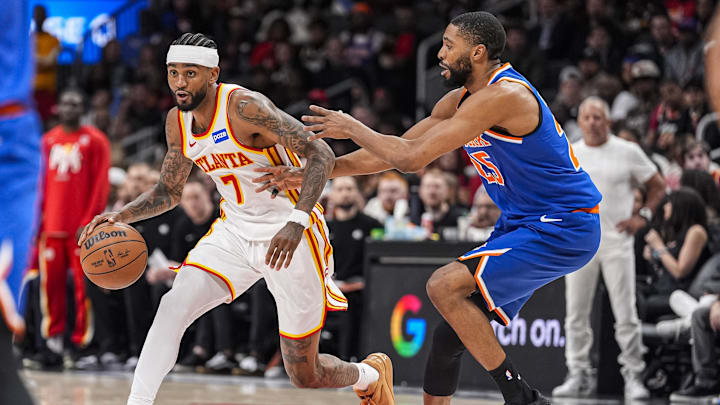 Apr 25, 2026; Atlanta, Georgia, USA; Atlanta Hawks guard Nickeil Alexander-Walker (7) dribbles against New York Knicks guard Mikal Bridges (25) during the second half during game four of the first round of the 2026 NBA Playoffs at State Farm Arena. Mandatory Credit: Dale Zanine-Imagn Images