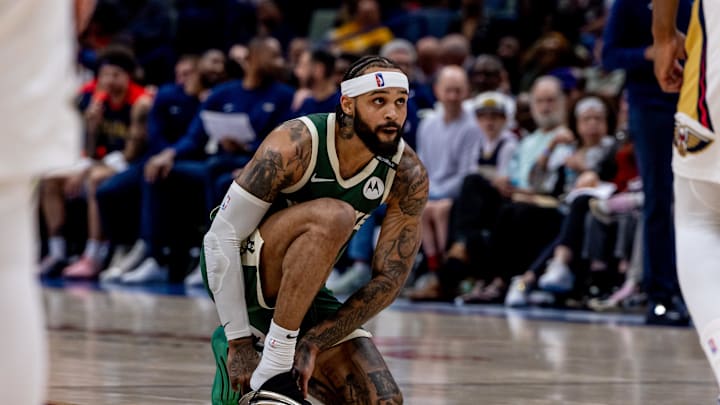 Milwaukee Bucks guard Gary Trent Jr. changes his shoe against the New Orleans Pelicans. Mandatory Credit: Stephen Lew-Imagn Images