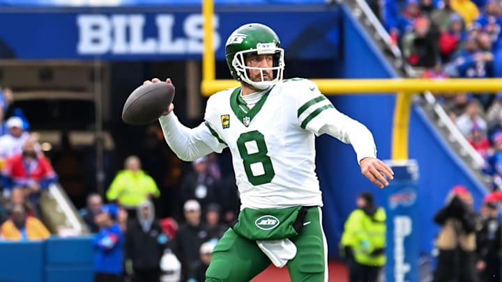 Dec 29, 2024; Orchard Park, New York, USA; New York Jets quarterback Aaron Rodgers (8) throws a pass in the first quarter against the Buffalo Bills at Highmark Stadium. Mandatory Credit: Mark Konezny-Imagn Images
