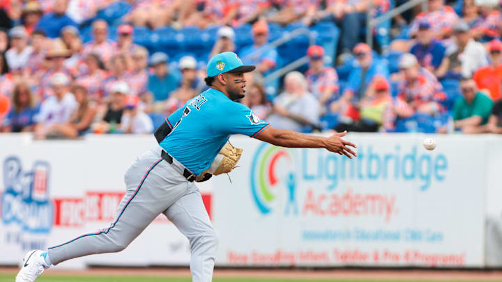 Feb 21, 2026; Port St. Lucie, Florida, USA; Miami Marlins first baseman Christopher Morel (5) tosses the ball to relief pitcher Tyler Phillips (not pictured) to retire New York Mets first baseman Jose Rojas (not pictured) during the third inning at Clover Park. Mandatory Credit: Sam Navarro-Imagn Images
