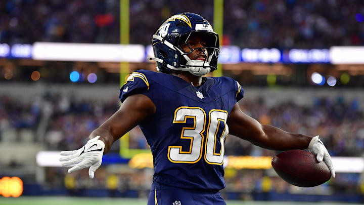 Oct 23, 2025; Inglewood, California, USA; Los Angeles Chargers running back Kimani Vidal (30) reacts after scoring a touchdown against the Minnesota Vikings during the first half at SoFi Stadium. 