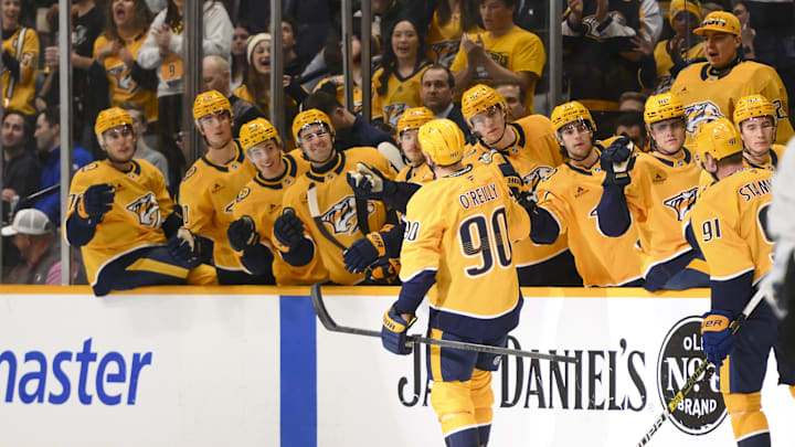Apr 14, 2025; Nashville, Tennessee, USA;  Nashville Predators center Ryan O'Reilly (90) celebrates his goal with his teammates against the Utah Hockey Club during the first period at Bridgestone Arena. Mandatory Credit: Steve Roberts-Imagn Images