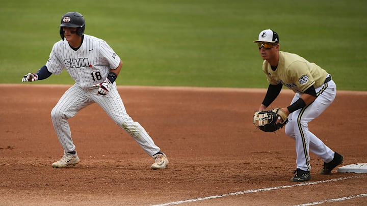The Wofford Terriers took on the  Samford Bulldogs for the Southern Conference Baseball Championship at Greenville's  Fluor Field on May 27, 2023.The Wofford Terriers took on the  Samford Bulldogs for the Southern Conference Baseball Championship at Greenville's  Fluor Field on May 27, 2023. Samford's Lucas Steele (18) on base as Wofford's Ryan Galena (14) guards base.