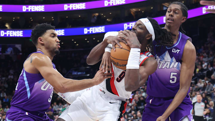 Feb 24, 2025; Salt Lake City, Utah, USA; Portland Trail Blazers forward Jerami Grant (9) battles for the ball with Utah Jazz forward KJ Martin (left) and forward Cody Williams (right) during the second half at Delta Center. Mandatory Credit: Rob Gray-Imagn Images Feb 24, 2025; Salt Lake City, Utah, USA; Portland Trail Blazers forward Jerami Grant (9) battles for the ball with Utah Jazz forward KJ Martin (left) and forward Cody Williams (right) during the second half at Delta Center. Mandatory Credit: Rob Gray-Imagn Images