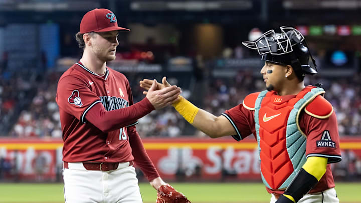 Sep 7, 2025; Phoenix, Arizona, USA; Arizona Diamondbacks pitcher Ryne Nelson (left) celebrates with catcher Gabriel Moreno following the last out of the fifth inning against the Boston Red Sox at Chase Field. Mandatory Credit: Mark J. Rebilas-Imagn Images Sep 7, 2025; Phoenix, Arizona, USA; Arizona Diamondbacks pitcher Ryne Nelson (left) celebrates with catcher Gabriel Moreno following the last out of the fifth inning against the Boston Red Sox at Chase Field. Mandatory Credit: Mark J. Rebilas-Imagn Images