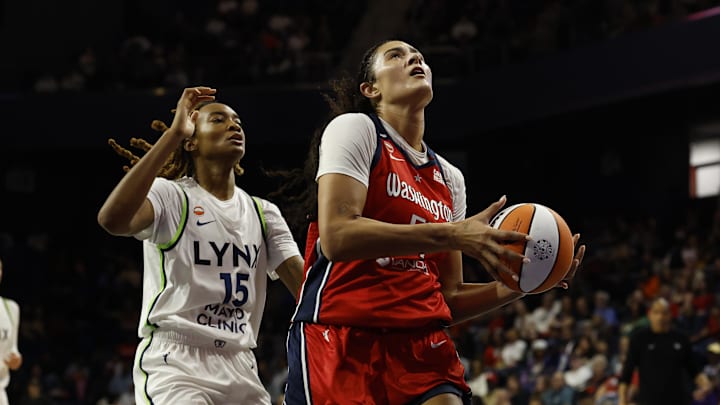 Apr 25, 2026; Washington, DC, USA; Washington Mystics center Lauren Betts (51) drives to the basket as Minnesota Lynx forward Jade Masogayo (15) defends in the first half at Entertainment & Sports Arena. Mandatory Credit: Geoff Burke-Imagn Images
