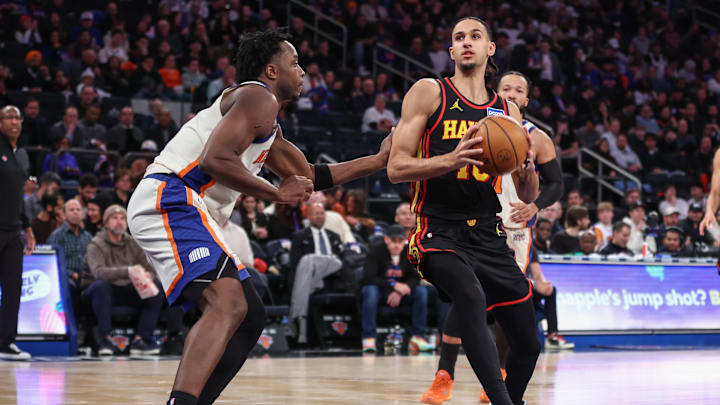 Jan 2, 2026; New York, New York, USA;  Atlanta Hawks forward Zaccharie Risacher (10) looks to drive past New York Knicks forward Og Anunoby (8) in the third quarter at Madison Square Garden. Mandatory Credit: Wendell Cruz-Imagn Images