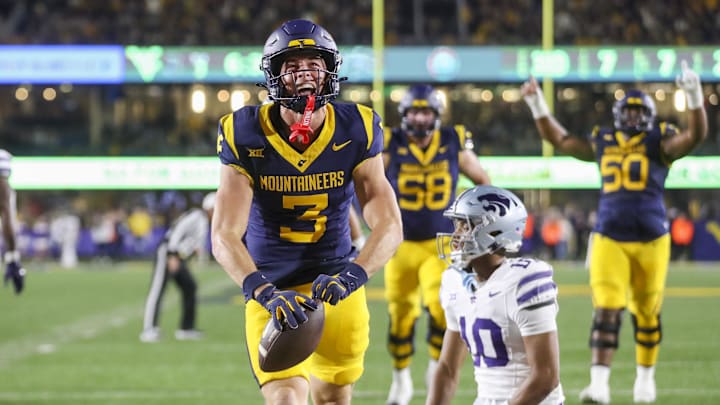 Oct 19, 2024; Morgantown, West Virginia, USA; West Virginia Mountaineers wide receiver Hudson Clement (3) celebrates after catching a pass for a touchdown during the second quarter against the Kansas State Wildcats at Mountaineer Field at Milan Puskar Stadium. Mandatory Credit: Ben Queen-Imagn Images