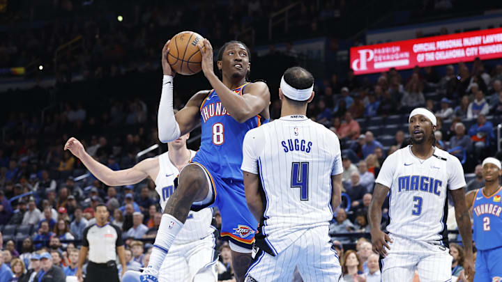 Nov 4, 2024; Oklahoma City, Oklahoma, USA; Oklahoma City Thunder forward Jalen Williams (8) drives to the basket against Orlando Magic guard Jalen Suggs (4) during the second half at Paycom Center. Mandatory Credit: Alonzo Adams-Imagn Images