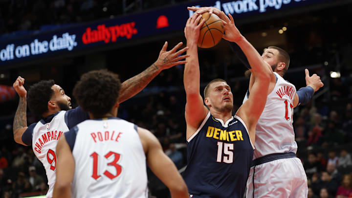 Dec 7, 2024; Washington, District of Columbia, USA; Denver Nuggets center Nikola Jokic (15) dribbles the ball as Washington Wizards center Jonas Valanciunas (17) defends in the first quarter at Capital One Arena. Mandatory Credit: Geoff Burke-Imagn Images Dec 7, 2024; Washington, District of Columbia, USA; Denver Nuggets center Nikola Jokic (15) dribbles the ball as Washington Wizards center Jonas Valanciunas (17) defends in the first quarter at Capital One Arena. Mandatory Credit: Geoff Burke-Imagn Images