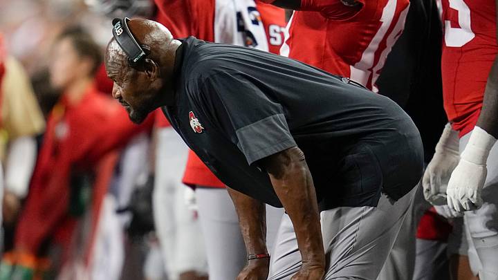 Ohio State Buckeyes defensive line coach Larry Johnson watches during the NCAA football game against the Minnesota Golden Gophers at Ohio Stadium in Columbus on Oct. 4, 2025. Ohio State Buckeyes defensive line coach Larry Johnson watches during the NCAA football game against the Minnesota Golden Gophers at Ohio Stadium in Columbus on Oct. 4, 2025.