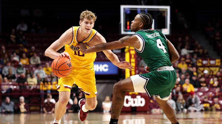 Nov 18, 2025; Minneapolis, Minnesota, USA; Minnesota Golden Gophers forward Cade Tyson (10) works around Chicago State Cougars guard Marcus Tankersley (4) during the first half at Williams Arena. Mandatory Credit: Matt Krohn-Imagn Images