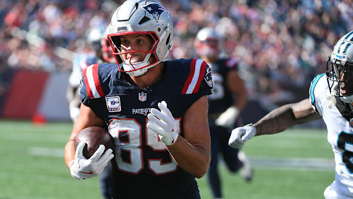 Sep 28, 2025; Foxborough, Massachusetts, USA; New England Patriots tight end Hunter Henry (85) runs with the ball for a touchdown during the second half against the Carolina Panthers at Gillette Stadium. 