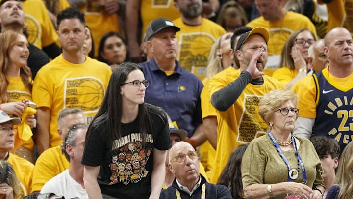 Caitlin Clark watches the first half of Game 4 of the NBA Finals.