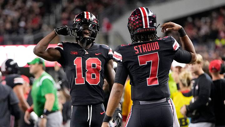 Sep 24, 2022; Columbus, Ohio, USA; Ohio State Buckeyes quarterback C.J. Stroud (7) celebrates a touchdown with wide receiver Marvin Harrison Jr. (18) during the first half of the NCAA Division I football game against the Wisconsin Badgers at Ohio Stadium. Mandatory Credit: Adam Cairns-The Columbus Dispatch

Ncaa Football Wisconsin Badgers At Ohio State Buckeyes