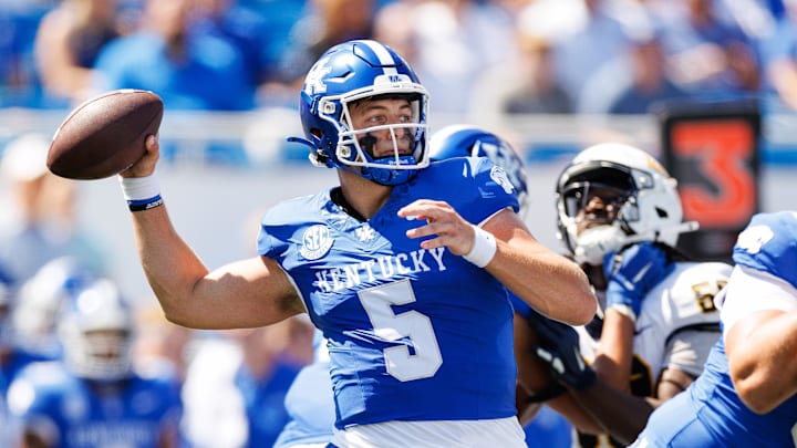 Aug 30, 2025; Lexington, Kentucky, USA; Kentucky Wildcats quarterback Zach Calzada (5) throws a pass during the first quarter against the Toledo Rockets at Kroger Field. Mandatory Credit: Jordan Prather-Imagn Images