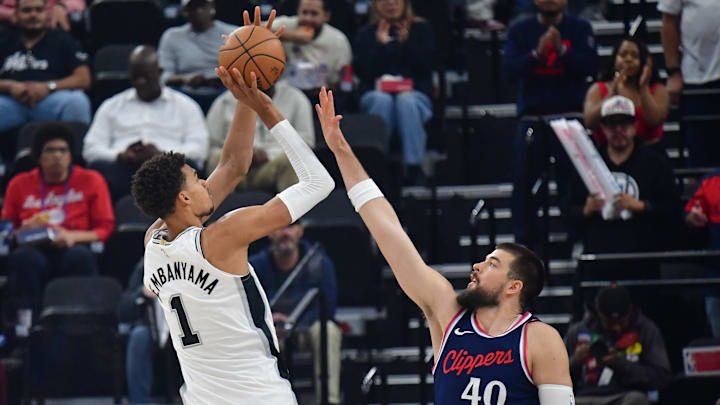 San Antonio Spurs center Victor Wembanyama (1) shoots against Los Angeles Clippers center Ivica Zubac (40) during the first half at Intuit Dome. Mandatory Credit: Gary A. Vasquez-Imagn Images