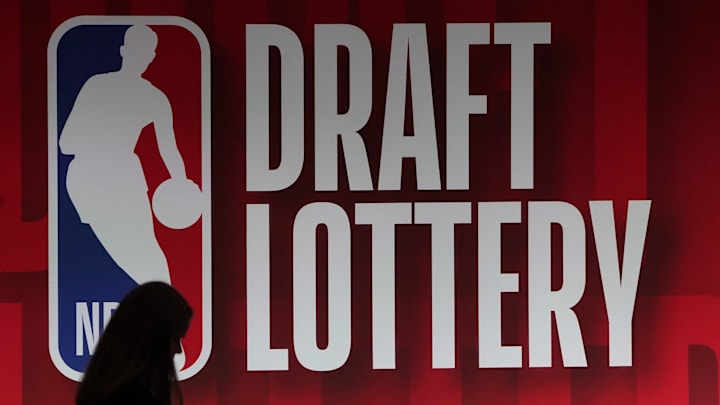 May 16, 2023; Chicago, IL, USA; People walk past the 2023 NBA Draft Lottery board at McCormick Place West. Mandatory Credit: David Banks-Imagn Images