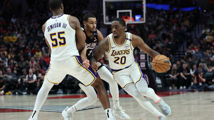 Apr 13, 2025; Portland, Oregon, USA; Los Angeles Lakers guard Shake Milton (20) dribbles the ball around his teammate Lakers’ center Trey Jemison III (55) past Portland Trail Blazers forward Kris Murray (24) in the second half at Moda Center. Mandatory Credit: Jaime Valdez-Imagn Images Apr 13, 2025; Portland, Oregon, USA; Los Angeles Lakers guard Shake Milton (20) dribbles the ball around his teammate Lakers’ center Trey Jemison III (55) past Portland Trail Blazers forward Kris Murray (24) in the second half at Moda Center. Mandatory Credit: Jaime Valdez-Imagn Images