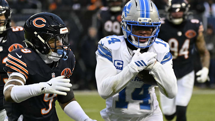 Jan 4, 2026; Chicago, Illinois, USA; Detroit Lions wide receiver Amon-Ra St. Brown (14) runs with the ball against Chicago Bears safety Jaquan Brisker (9) during the first half at Soldier Field. Mandatory Credit: Matt Marton-Imagn Images Jan 4, 2026; Chicago, Illinois, USA; Detroit Lions wide receiver Amon-Ra St. Brown (14) runs with the ball against Chicago Bears safety Jaquan Brisker (9) during the first half at Soldier Field. Mandatory Credit: Matt Marton-Imagn Images