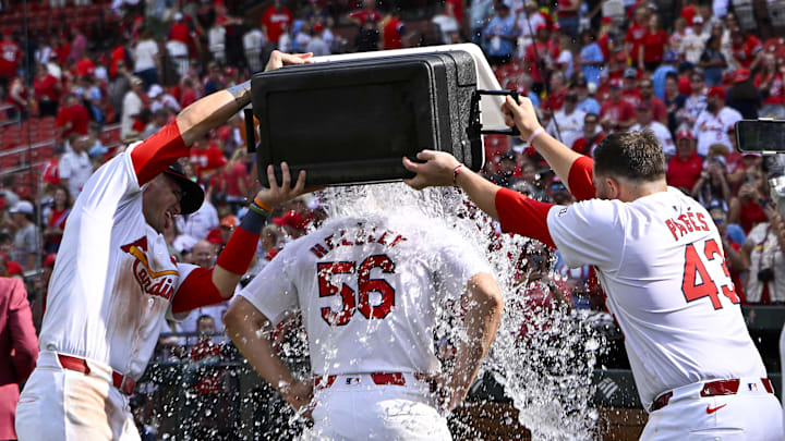 Sep 22, 2024; St. Louis, Missouri, USA;  St. Louis Cardinals relief pitcher Ryan Helsley (56) is doused with water by center fielder Lars Nootbaar (21) and catcher Pedro Pages (43) after the Cardinals defeated the Cleveland Guardians at Busch Stadium. Mandatory Credit: Jeff Curry-Imagn Images