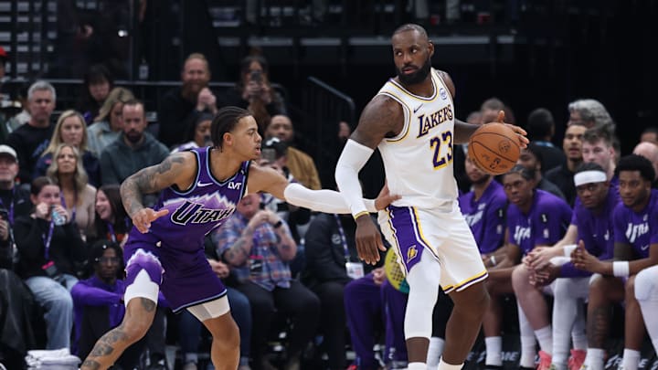 Nov 23, 2025; Salt Lake City, Utah, USA; Los Angeles Lakers forward LeBron James (23) dribbles as Utah Jazz guard Keyonte George (3) defends during the second half at Delta Center. Mandatory Credit: Rob Gray-Imagn Images