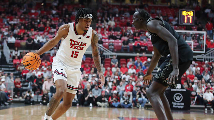 Feb 11, 2026; Lubbock, Texas, USA;  Texas Tech Red Raiders forward JT Toppin (15) looks for an opening against Colorado Buffaloes forward Bangot Dak (8) in the first half at United Supermarkets Arena. Mandatory Credit: Michael C. Johnson-Imagn Images