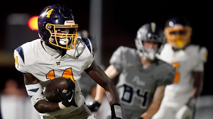 Webb’s Joel Wyatt (14) runs the ball against Pope John Paul II during the second half at Pope Saint John Paul II Preparatory School in Hendersonville, Tenn., Friday, Sept. 13, 2024.