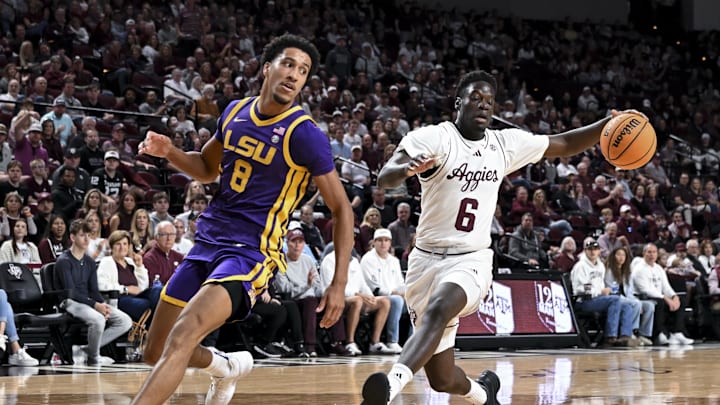 Jan 3, 2026; College Station, Texas, USA; Texas A&M Aggies guard Ali Dibba (6) drives to the basket against Louisiana State Tigers forward Pablo Tamba (8) at Reed Arena. Mandatory Credit: Maria Lysaker-Imagn Images 