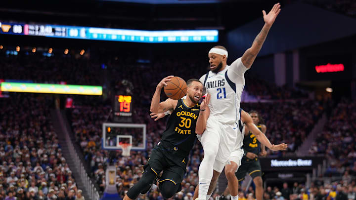 Nov 12, 2024; San Francisco, California, USA; Golden State Warriors guard Stephen Curry (30) is fouled by Dallas Mavericks forward Daniel Gafford (21) in the third quarter at the Chase Center. Mandatory Credit: Cary Edmondson-Imagn Images