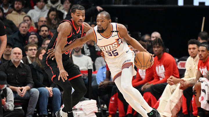 Feb 23, 2025; Toronto, Ontario, CAN; Phoenix Suns forward Kevin Durant (35) drives toward the basket against Toronto Raptors guard Ochai Agbaji (30) in the first half at Scotiabank Arena. Mandatory Credit: Dan Hamilton-Imagn Images
