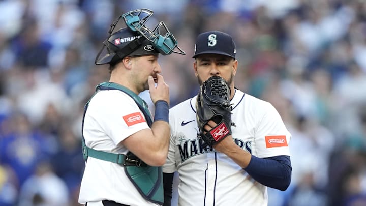 Oct 5, 2025; Seattle, Washington, USA; Seattle Mariners pitcher Luis Castillo (58) and catcher Cal Raleigh (29) meet on the mound in the second inning against the Detroit Tigers during game two of the ALDS round for the 2025 MLB playoffs at T-Mobile Park. Mandatory Credit: Stephen Brashear-Imagn Images