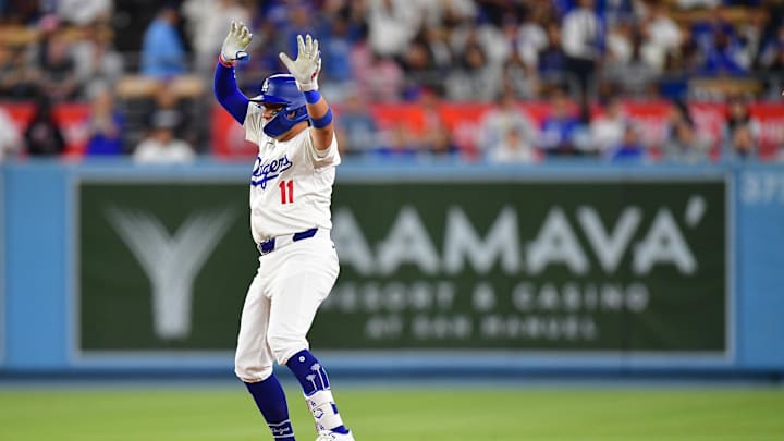 Aug 29, 2024; Los Angeles, California, USA; Los Angeles Dodgers shortstop Miguel Rojas (11) reaches second on a double against the Baltimore Orioles during the seventh inning at Dodger Stadium. Mandatory Credit: Gary A. Vasquez-Imagn Images