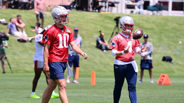 Jun 10, 2024; Foxborough, MA, USA;  New England Patriots quarterback Drake Maye (10) and quarterback Bailey Zappe (4) participate at minicamp at Gillette Stadium. Mandatory Credit: Eric Canha-USA TODAY Sports