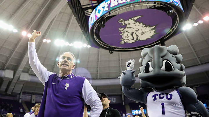 Feb. 5, 2025-TCU Head Coach Jamie Dixon and Super Frog celebrate Dixon's 500th career win as TCU beat West Virginia in the Schollmaier Arena. Feb. 5, 2025-TCU Head Coach Jamie Dixon and Super Frog celebrate Dixon's 500th career win as TCU beat West Virginia in the Schollmaier Arena.