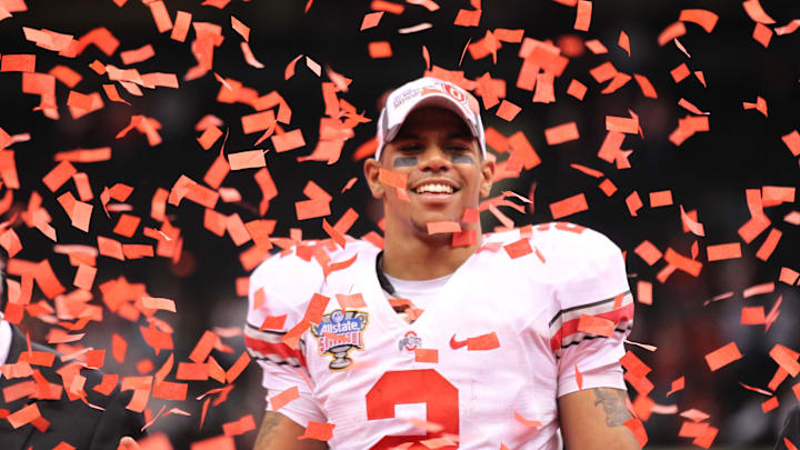 Jan 4, 2011; New Orleans, LA, USA; Ohio State Buckeye quarterback Terrelle Pryor (2) smiles as confetti falls down after a victory against the Arkansas Razorbacks during the 2011 Sugar Bowl at the Louisiana Superdome . The Buckeyes beat the Razorbacks 31-26. Mandatory Credit: Matthew Emmons-Imagn Images