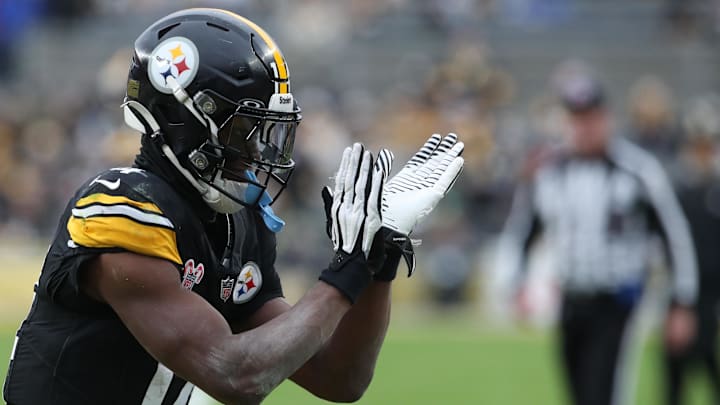 Dec 25, 2024; Pittsburgh, Pennsylvania, USA;  Pittsburgh Steelers wide receiver George Pickens (14) reacts after a Kansas City Chiefs penalty during the fourth quarter at Acrisure Stadium. Mandatory Credit: Charles LeClaire-Imagn Images