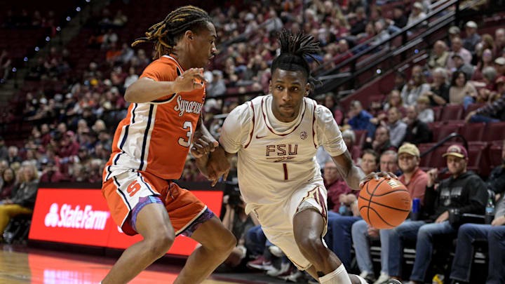 Jan 4, 2025; Tallahassee, Florida, USA; Florida State Seminoles forward Jamir Watkins (1) drives the ball to the net against Syracuse Orange guard Lucas Taylor (3) during the first half at Donald L. Tucker Center. Mandatory Credit: Melina Myers-Imagn Images Jan 4, 2025; Tallahassee, Florida, USA; Florida State Seminoles forward Jamir Watkins (1) drives the ball to the net against Syracuse Orange guard Lucas Taylor (3) during the first half at Donald L. Tucker Center. Mandatory Credit: Melina Myers-Imagn Images