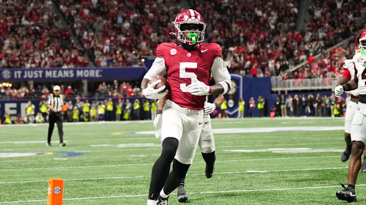 Dec 6, 2025; Atlanta, GA, USA; Alabama Crimson Tide wide receiver Germie Bernard (5) scores a touchdown during the fourth quarter against the Georgia Bulldogs during the 2025 SEC Championship game at Mercedes-Benz Stadium. 