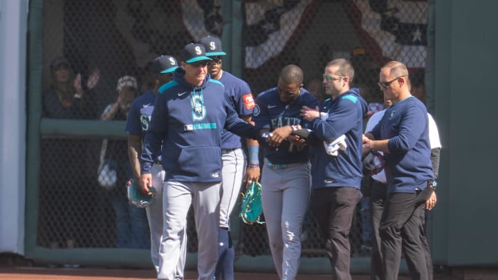 Seattle Mariners right fielder Victor Robles (10) is injured during the play against the San Francisco Giants during the ninth inning attended medical personal at Oracle Park on April 6.