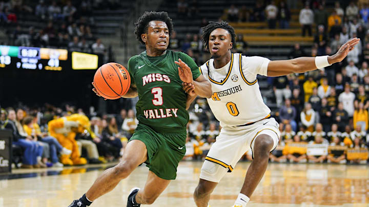 Nov 14, 2024; Columbia, Missouri, USA; Mississippi Valley State Delta Devils guard Donovan Sanders (3) drives against Missouri Tigers guard Anthony Robinson II (0) during the first half at Mizzou Arena. Mandatory Credit: Jay Biggerstaff-Imagn Images