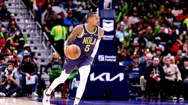 Nov 27, 2024; New Orleans, Louisiana, USA;  New Orleans Pelicans guard Dejounte Murray (5) brings the ball up court against the Toronto Raptors during the first half at Smoothie King Center. Mandatory Credit: Stephen Lew-Imagn Images