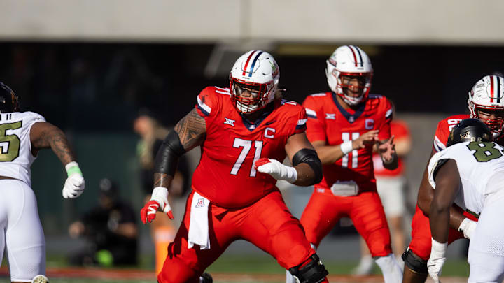 Oct 19, 2024; Tucson, Arizona, USA; Arizona Wildcats offensive lineman Jonah Savaiinaea (71) against the Colorado Buffalos at Arizona Stadium. Mandatory Credit: Mark J. Rebilas-Imagn Images