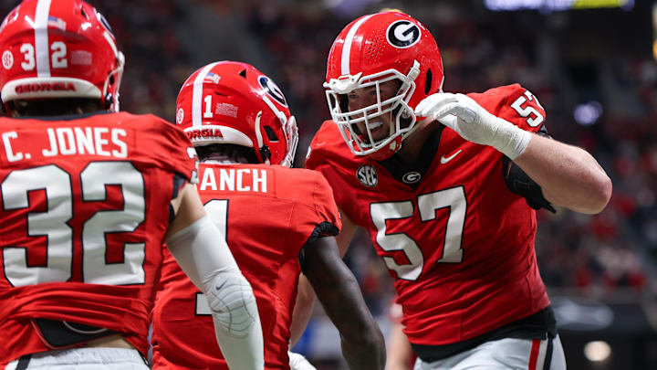 Nov 28, 2025; Atlanta, Georgia, USA; Georgia Bulldogs wide receiver Zachariah Branch (1) celebrates with offensive lineman Monroe Freeling (57) after a touchdown catch against the Georgia Tech Yellow Jackets in the second quarter at Mercedes-Benz Stadium. Mandatory Credit: Brett Davis-Imagn Images
Nov 28, 2025; Atlanta, Georgia, USA; Georgia Bulldogs wide receiver Zachariah Branch (1) celebrates with offensive lineman Monroe Freeling (57) after a touchdown catch against the Georgia Tech Yellow Jackets in the second quarter at Mercedes-Benz Stadium. Mandatory Credit: Brett Davis-Imagn Images