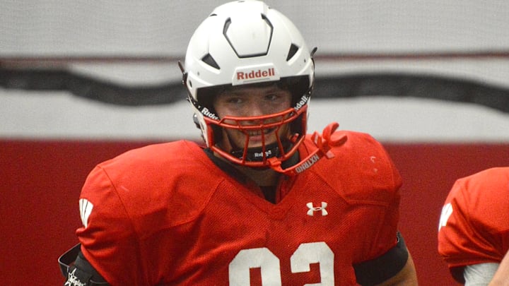 2027 in-state offensive lineman Hunter Mallinger (Sussex Hamilton) jogs off the field after a drill during Wisconsin football's June 15 camp.
