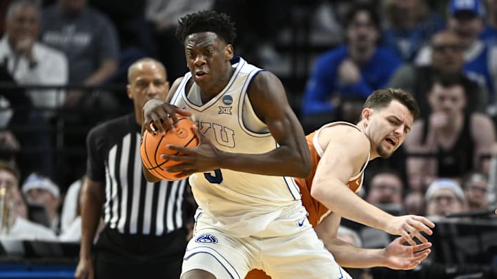 Mar 19, 2026; Portland, OR, USA; BYU Cougars forward AJ Dybantsa (3) keeps the ball from Texas Longhorns forward Camden Heide (5) in the second half during a first round game of the men's 2026 NCAA Tournament at Moda Center. Mandatory Credit: Craig Strobeck-Imagn Images