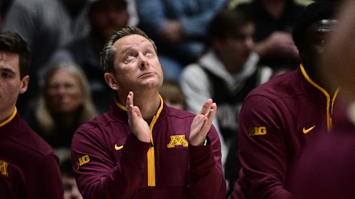 Dec 10, 2025; West Lafayette, Indiana, USA; Minnesota Golden Gophers head coach Niko Medved looks up at the video board during the first half against the Purdue Boilermakers at Mackey Arena. Mandatory Credit: Marc Lebryk-Imagn Images